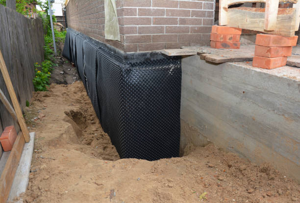 Happy homeowners after waterproofing job in Broad Run